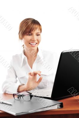 Young business woman on a laptop - isolated on white