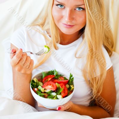 Closeup portrait of pretty caucasian woman having a healthy diet