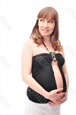 Image of pregnant woman touching her belly with hands