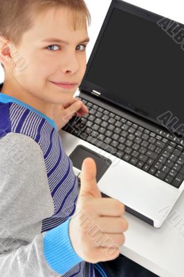 Portrait of a cute little boy using a laptop