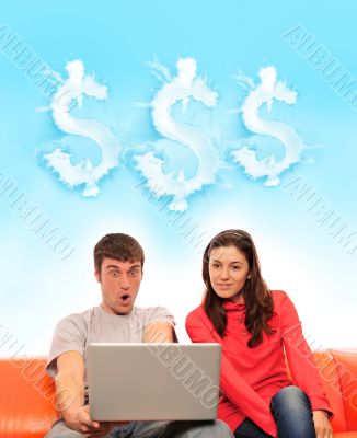 Portrait of a young couple using a computer