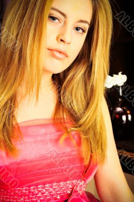 Closeup portrait of young pretty woman doing makeup and hairstyl