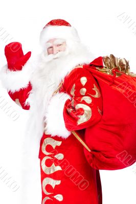 Santa Claus standing up on white background with his bag full of