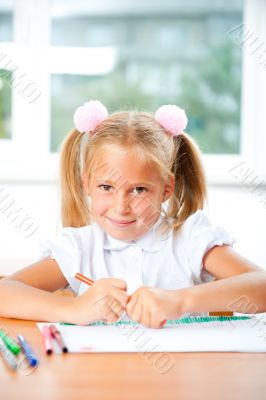 Little girl looking for a drawing concept wile painting picture 
