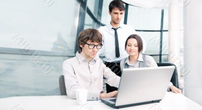 Portrait of confident business man explaining a project to colle