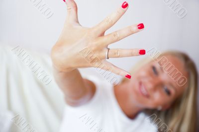 Happy young woman showing her proposal ring from her boyfriend. 