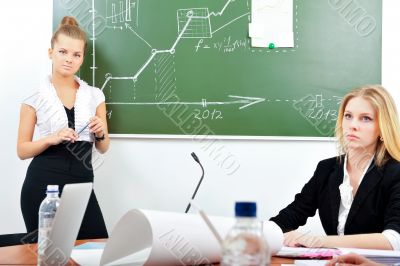 Portrait of two young business women at their office