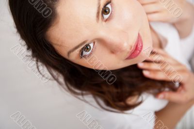 Portrait of a charming young lady relaxing on couch