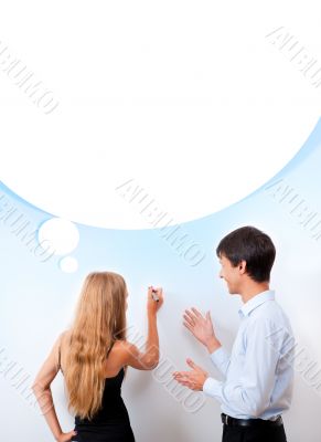 Confident adult teacher helping to students in school classroom Confident adult teacher helping to students in school classroom