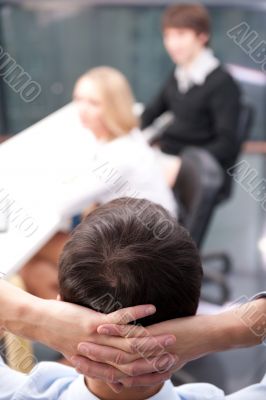 Closeup portrait of a smart young businessman smiling and his co