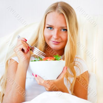 Closeup portrait of pretty caucasian woman having a healthy diet