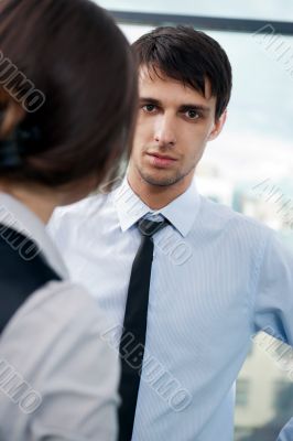 Two contemporary business people at a meeting