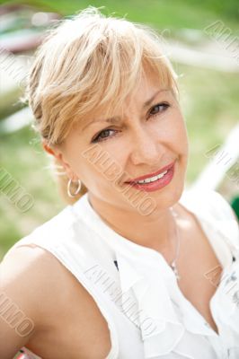 Portrait of a female smiling in a park