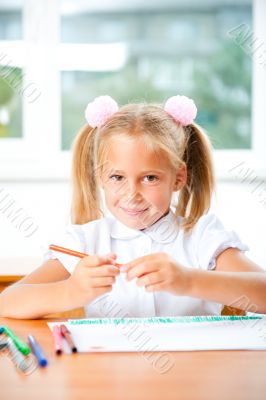 Little girl looking for a drawing concept wile painting picture 