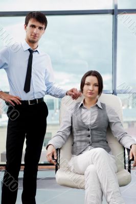 Two contemporary business people at a meeting