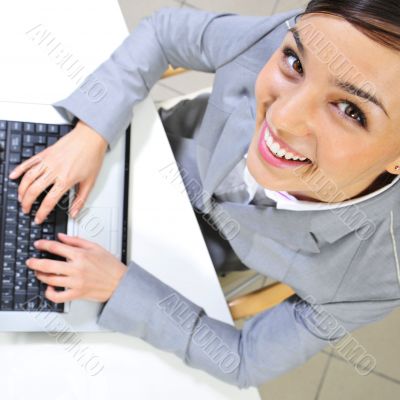 Young business woman on a laptop at her office. Working