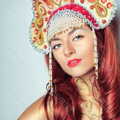 Closeup portrait of pretty young woman with red hairs