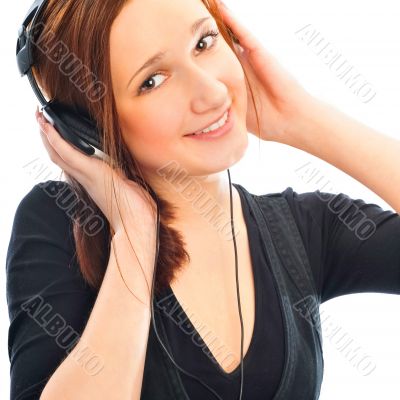 Beautiful woman with headphones, she is listen to the music