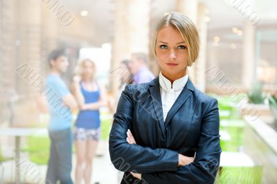 Portrait of a cute business woman with colleagues at the backgro