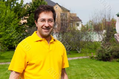 Portrait of adult active healthy man standing relaxed at his bac