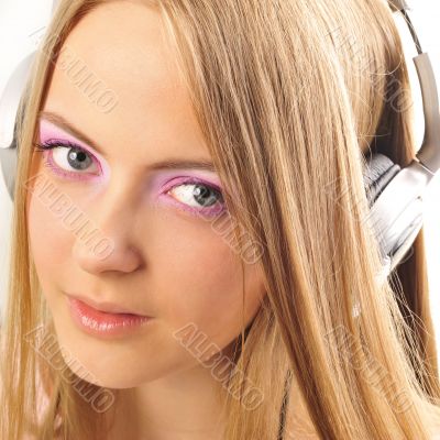 Beautiful woman with headphones, she is listening to the music