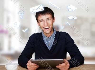 A businessman with icons floating around his head. Portrait of h