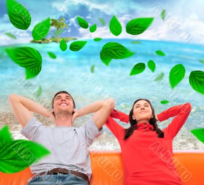 Closeup portrait of adult couple sitting on their sofa at their 