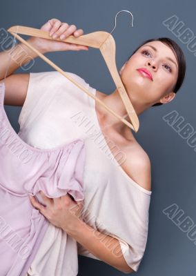 Portrait of pretty fashionable woman trying new clothes. Fashion