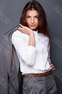 Portrait of a beautiful young business woman standing with hand 