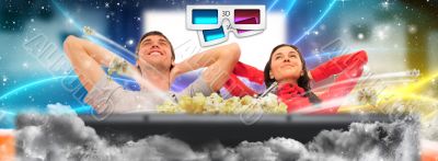 Close up of a cute couple watching movie on their home cinema st