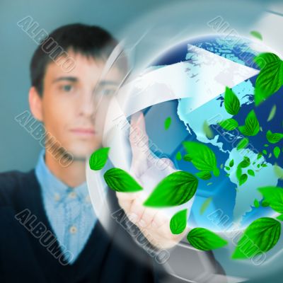 Portrait of young man sitting indoors at his office and working.