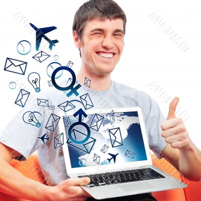 Closeup of a young smiling business man sitting at his home offi