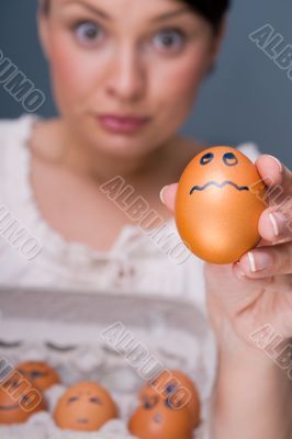 Portrait of young pretty business woman against grey background 