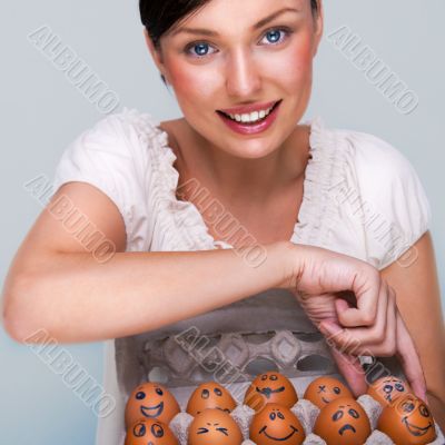 Portrait of young pretty business woman against grey background 