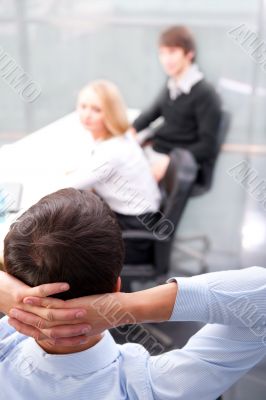 Closeup portrait of a smart young businessman smiling and his co