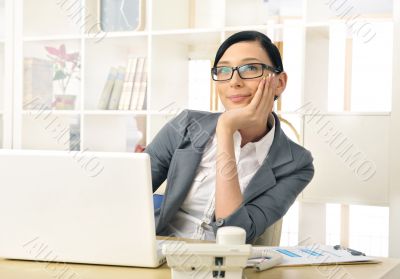 Portrait of a beautiful young businesswoman thinking.
