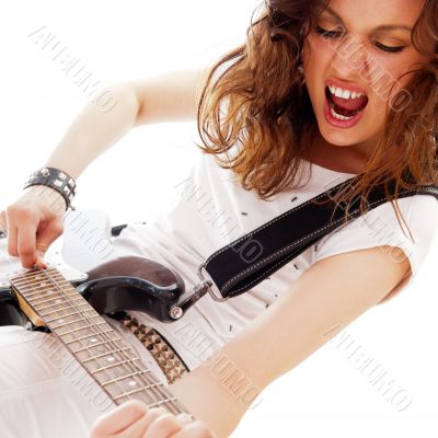 Portrait of beautiful young and attractive womanplaying her guit