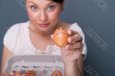 Portrait of young pretty business woman against grey background 