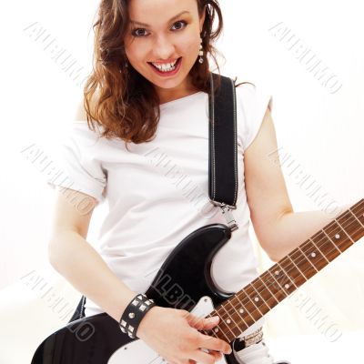 Portrait of young pretty girl who is feeling free and playing gu