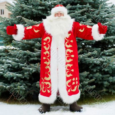 Full Length Portrait of Santa Claus standing with open hands out