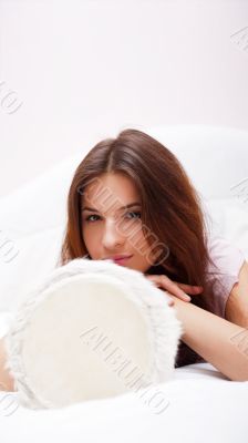 Happy young pretty woman at home, smiling and playing arabic tra