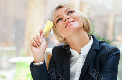 Closeup portrait of cute young business woman smiling while hold