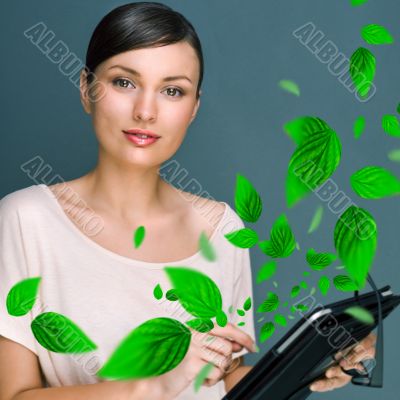 Portrait of young woman standing indoors at her office and worki