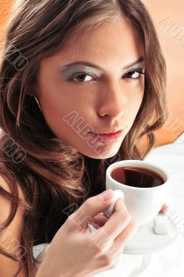 Fashion portrait of young elegant woman in bed