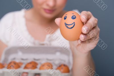 Portrait of young pretty business woman against grey background 