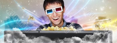 Portrait of young stylish modern man wearing 3d glasses watching