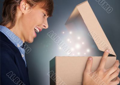 Portrait of young man received christmas gift. He opened gift bo