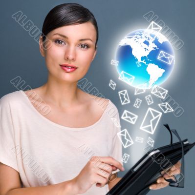 Portrait of pretty young woman holding Touch Screen tablet compu