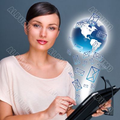 Portrait of pretty young woman holding Touch Screen tablet compu