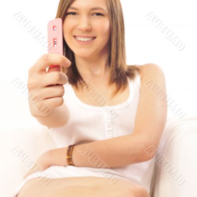 Pregnancy test - happy surprised woman, positive result